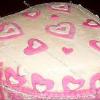 Raye's Signature 10" Orange Heart Cake w/ Whipped Orange Pineapple Filling & Pink & White Vanilla Fondant Covering & Accents (left)